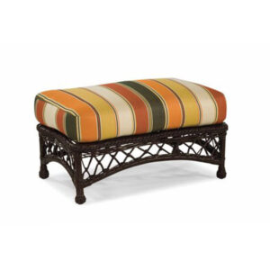 Striped cushioned ottoman with dark wooden frame and woven sides.