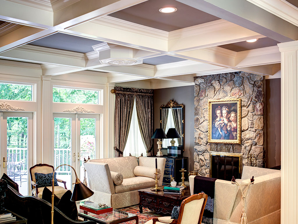Elegant living room with stone fireplace and classic decor.